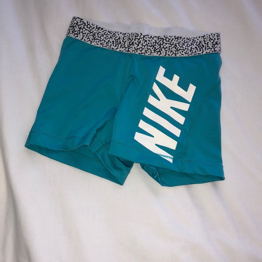 teal nike pros